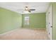 Bedroom with neutral carpet, green walls, and natural light at 825 Bufflehead Ct, Stockbridge, GA 30281
