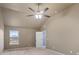 Bedroom featuring high, vaulted ceilings, carpeted floors, and natural light at 825 Bufflehead Ct, Stockbridge, GA 30281