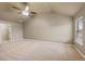 Vaulted ceiling bedroom features neutral carpet, and a large window at 825 Bufflehead Ct, Stockbridge, GA 30281