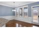 A bright dining area features hardwood floors, natural light, and a backyard view at 825 Bufflehead Ct, Stockbridge, GA 30281