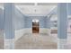 Spacious dining room with coffered ceilings and archways; features access to the kitchen and other rooms at 825 Bufflehead Ct, Stockbridge, GA 30281