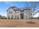 Attractive two-story house boasting traditional brickwork, complemented by a well-kept front lawn at 825 Bufflehead Ct, Stockbridge, GA 30281