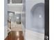 Inviting hallway with hardwood floors, archways and modern wall trim for a welcoming feel at 825 Bufflehead Ct, Stockbridge, GA 30281
