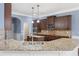 Gourmet kitchen features a large island, granite countertops, and stainless steel sink at 825 Bufflehead Ct, Stockbridge, GA 30281