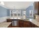 Open concept kitchen area with large island, stainless appliances, and plenty of room to entertain at 825 Bufflehead Ct, Stockbridge, GA 30281