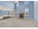 Open living space with high ceilings, stone fireplace, and large windows offering natural light at 825 Bufflehead Ct, Stockbridge, GA 30281
