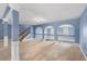 Spacious open loft area with decorative archways and a staircase at 825 Bufflehead Ct, Stockbridge, GA 30281