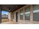 Covered patio with fan features an outdoor space with brick accents at 825 Bufflehead Ct, Stockbridge, GA 30281