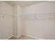 Walk-in closet with wire shelving and neutral carpeting at 825 Bufflehead Ct, Stockbridge, GA 30281