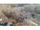 A nice residential home nestled amongst the trees, features a private pond at 880 Streamside Dr, Mcdonough, GA 30252
