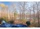 View of backyard featuring a lake, fencing, a slide, and a covered pool at 880 Streamside Dr, Mcdonough, GA 30252