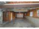 Large unfinished basement with garage door access, ready to be customized at 880 Streamside Dr, Mcdonough, GA 30252