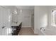 Bathroom featuring double vanity, soaking tub, and separate shower at 880 Streamside Dr, Mcdonough, GA 30252