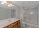Bright bathroom with a shower and a light wood vanity at 880 Streamside Dr, Mcdonough, GA 30252