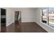Spacious dining room featuring elegant wainscoting, dark hardwood floors, and ample natural light at 880 Streamside Dr, Mcdonough, GA 30252