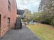 Backyard view of a brick home with stairs leading to a deck overlooking a pool at 880 Streamside Dr, Mcdonough, GA 30252