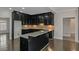 Stylish kitchen featuring granite counters and central island at 880 Streamside Dr, Mcdonough, GA 30252