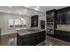 Gourmet kitchen featuring granite counters, breakfast bar, and stainless appliances at 880 Streamside Dr, Mcdonough, GA 30252