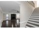 Bright living room features dark hardwood flooring, a cozy fireplace, and seamless access to an outdoor patio at 880 Streamside Dr, Mcdonough, GA 30252