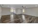 Expansive room featuring ample natural light and stylish wide plank flooring at 880 Streamside Dr, Mcdonough, GA 30252