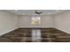 Expansive room featuring ample natural light and stylish wide plank flooring at 880 Streamside Dr, Mcdonough, GA 30252