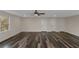 Expansive room featuring ample natural light and stylish wide plank flooring at 880 Streamside Dr, Mcdonough, GA 30252
