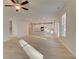 Open-concept living area with modern kitchen, hardwood floors, and natural light at 121 Belvedere Rd, Mcdonough, GA 30253