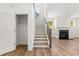 Staircase with wood treads and access to the living room at 14 Ramble Way, Sharpsburg, GA 30277