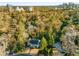 Aerial view of estate with mature trees; the Atlanta skyline is visible in the distance at 2 W Muscogee Nw Ave, Atlanta, GA 30305