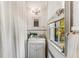 Bright bathroom features a pedestal sink, natural light, and classic tile work at 2 W Muscogee Nw Ave, Atlanta, GA 30305