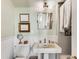Traditional bathroom with pedestal sink, subway tile, and classic fixtures and decor at 2 W Muscogee Nw Ave, Atlanta, GA 30305
