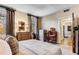 Comfortable bedroom features warm lighting, hardwood floors, and classic decor for a relaxing retreat at 2 W Muscogee Nw Ave, Atlanta, GA 30305