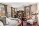 Comfortable bedroom featuring an antique hutch and a cozy reading nook at 2 W Muscogee Nw Ave, Atlanta, GA 30305