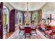 Elegant dining room with arched doorway, crystal chandelier, and large windows with natural light at 2 W Muscogee Nw Ave, Atlanta, GA 30305