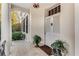 Inviting front entrance with double doors, complemented by potted plants and stone tile flooring at 2 W Muscogee Nw Ave, Atlanta, GA 30305