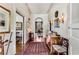 Elegant hallway with hardwood floors, arched doorways, and decorative wall sconces at 2 W Muscogee Nw Ave, Atlanta, GA 30305