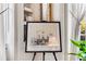Architectural drawing displayed on an easel with natural light from a nearby window at 2 W Muscogee Nw Ave, Atlanta, GA 30305