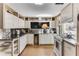 Kitchen showcasing countertops, white cabinetry, and stainless steel appliances at 2 W Muscogee Nw Ave, Atlanta, GA 30305