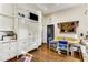Spacious kitchen with custom cabinetry, breakfast nook, hardwood floors, and modern appliances at 2 W Muscogee Nw Ave, Atlanta, GA 30305