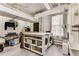 Spacious laundry room with exposed brick, modern machines, and ample storage space at 2 W Muscogee Nw Ave, Atlanta, GA 30305