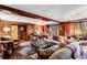 Classic living room with wood paneling, large area rug, and comfortable seating at 2 W Muscogee Nw Ave, Atlanta, GA 30305