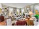 Sophisticated living room with custom built-in bookshelves, a fireplace, and elegant furnishings at 2 W Muscogee Nw Ave, Atlanta, GA 30305