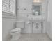 Bright bathroom features an ornate sink and subway tile at 4084 Peachtree Dunwoody Ne Rd, Atlanta, GA 30342