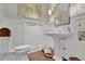 Clean and classic powder room with a pedestal sink and hardwood floors at 4084 Peachtree Dunwoody Ne Rd, Atlanta, GA 30342