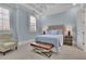 Calm bedroom features soft blue walls and shuttered windows at 4084 Peachtree Dunwoody Ne Rd, Atlanta, GA 30342