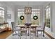 Elegant dining area featuring a decorative chandelier and large windows providing abundant natural light at 4084 Peachtree Dunwoody Ne Rd, Atlanta, GA 30342