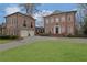 Beautiful brick home with attached garage and circular driveway on a meticulously landscaped lot at 4084 Peachtree Dunwoody Ne Rd, Atlanta, GA 30342