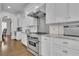 Close-up of kitchen with stainless steel appliances and granite countertops with white subway tile backsplash at 4084 Peachtree Dunwoody Ne Rd, Atlanta, GA 30342