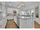 Modern kitchen with white cabinetry, an island with seating, and stainless steel appliances at 4084 Peachtree Dunwoody Ne Rd, Atlanta, GA 30342