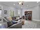 Living room boasts a comfortable leather couch, desk and hutch, and backyard access at 4084 Peachtree Dunwoody Ne Rd, Atlanta, GA 30342